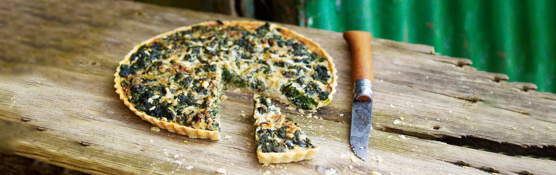 Nettle and Garlic Tart on Wooden Board