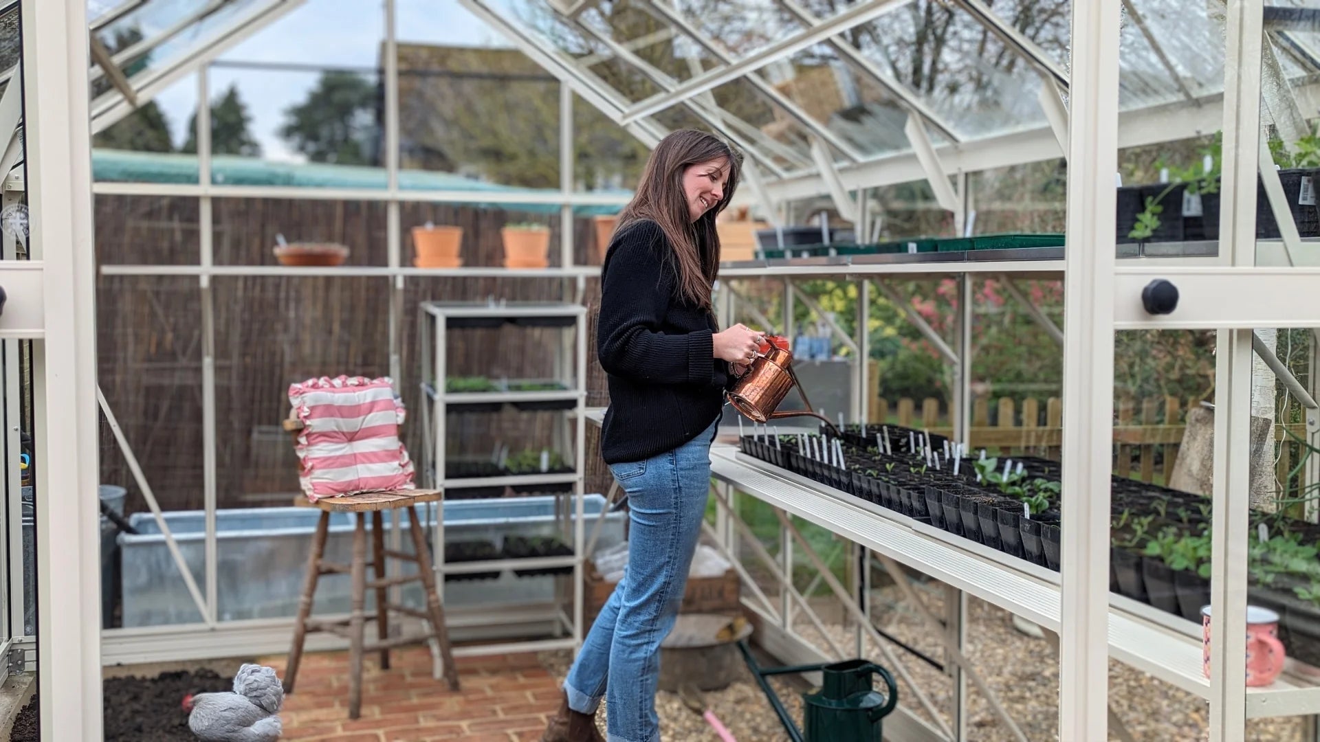 Lady watering her seedlings