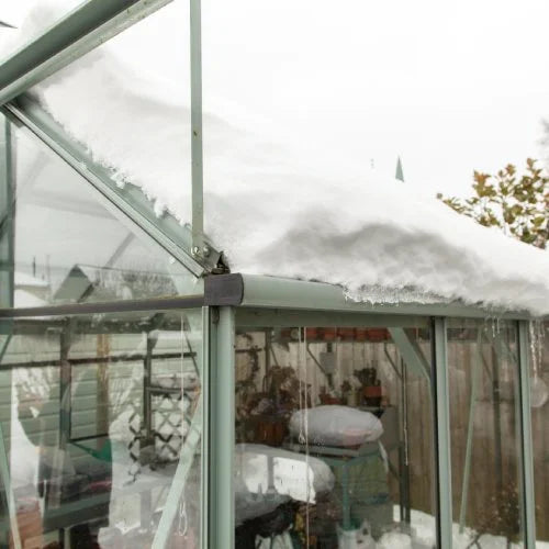 rhino greenhouse covered in snow