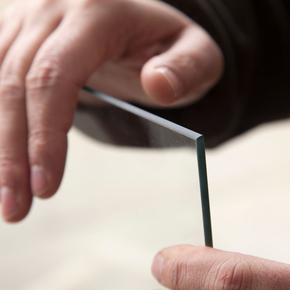 Man holding toughened safety pane